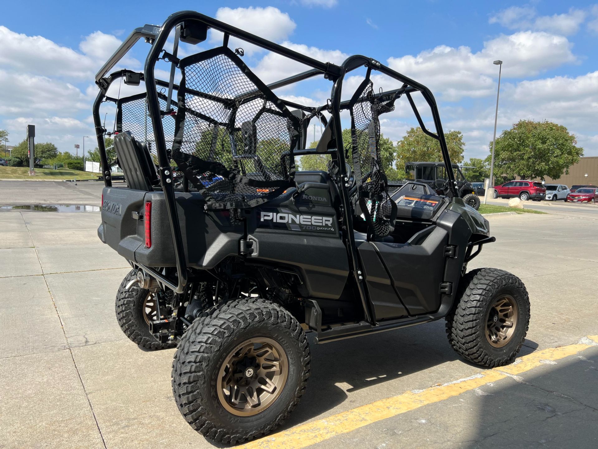 2025 Honda Pioneer 700-4 Deluxe in Black Forest Green | For Sale