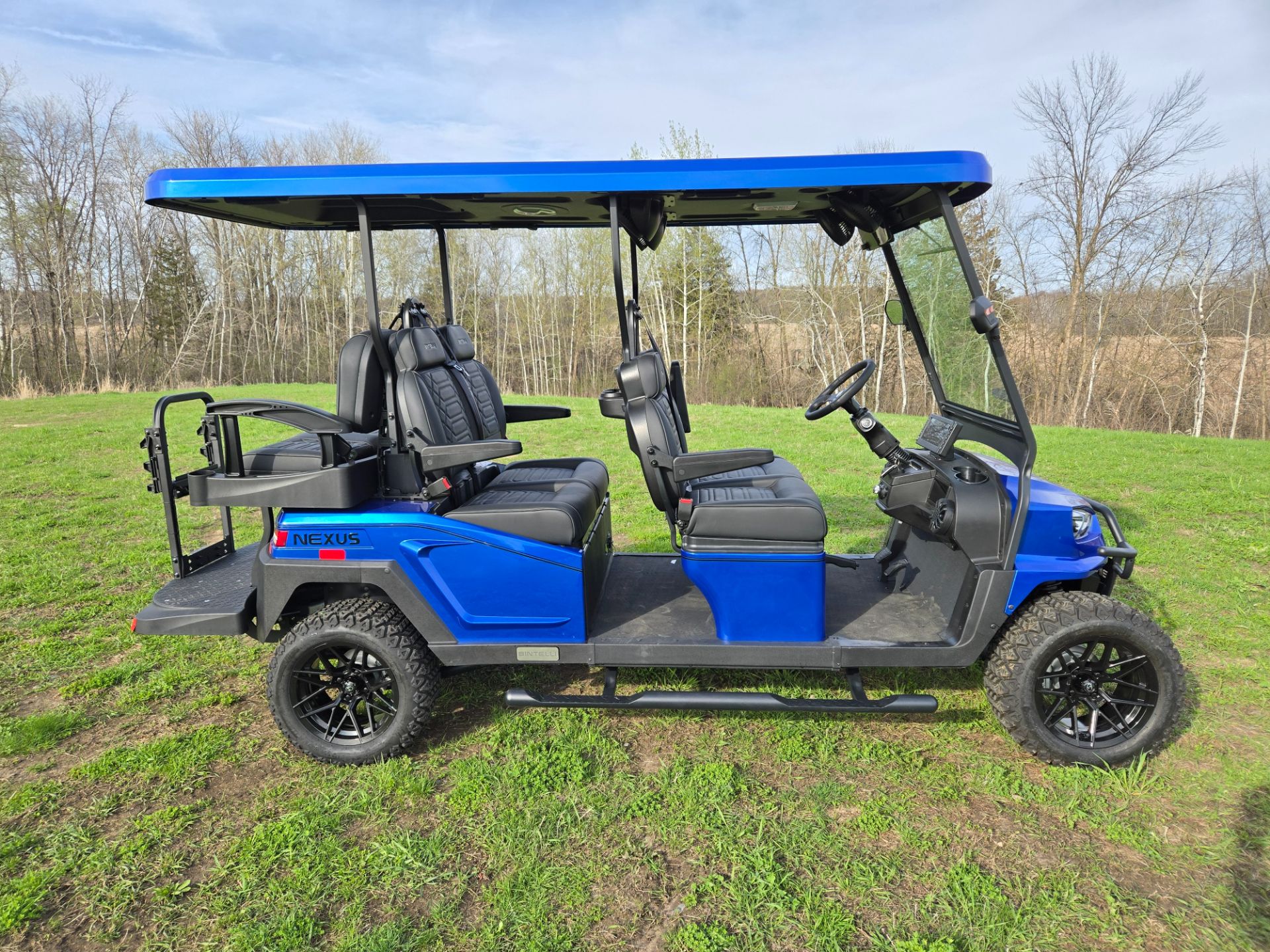 【J29302】Fab Groove / Atlantic Blue New 2025 Bintelli Nexus 6 Seater Lifted | Golf Carts in Forest