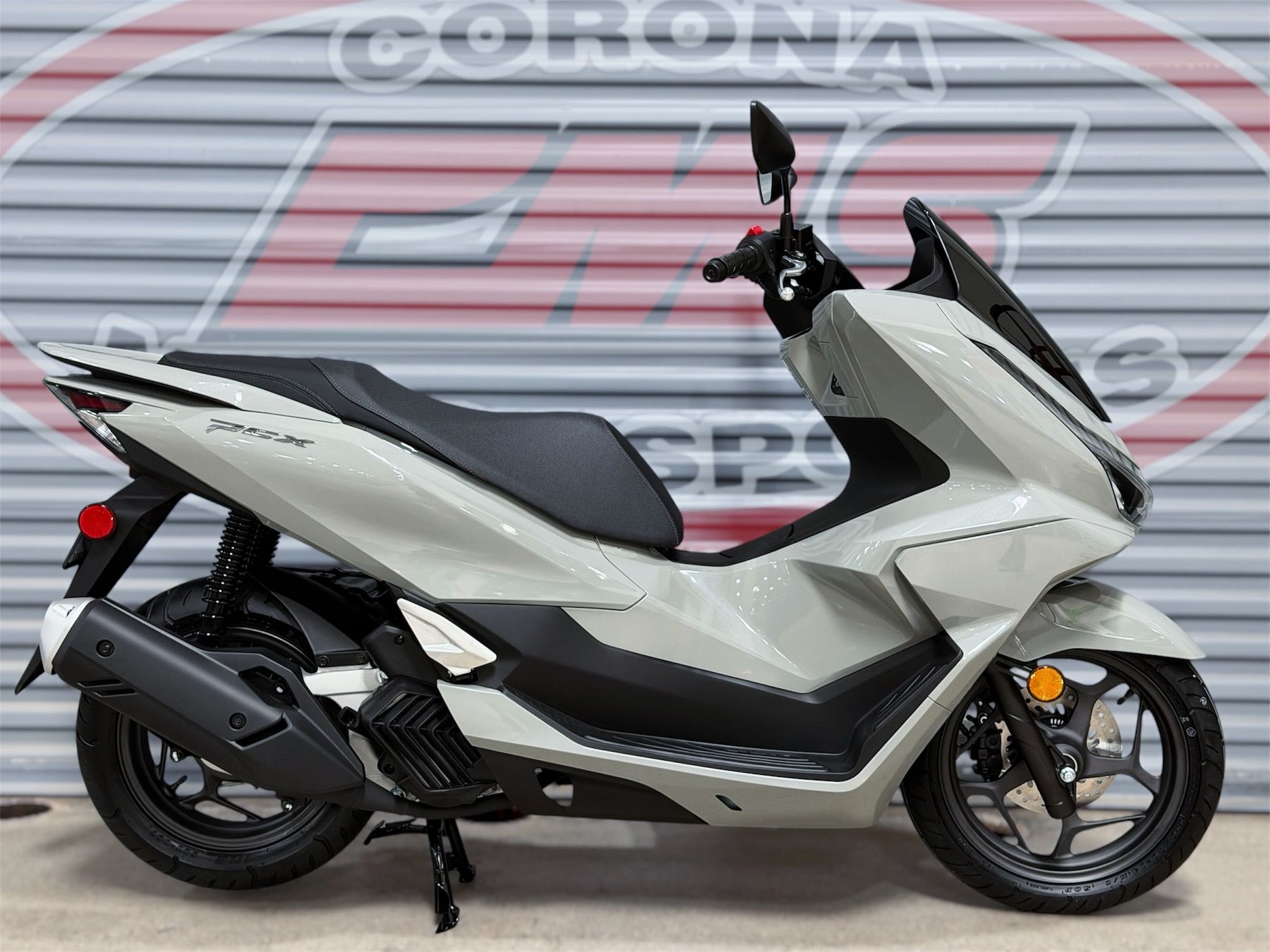 2026 Honda PCX in Pearl Gray — front three-quarter view