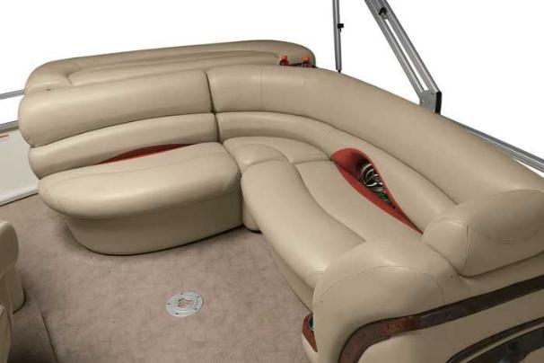 The aft L-lounge features comfortable seating, drink holders, a padded sundeck and a base position for the movable table. - Photo 19