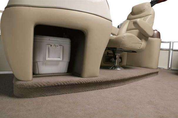 The console at the elevated helm station also has storage for the removable cooler. - Photo 4