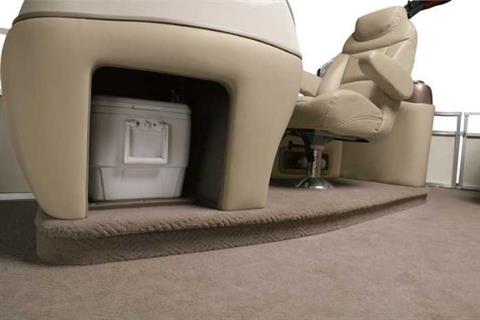 The console at the elevated helm station also has storage for the removable cooler. - Photo 4